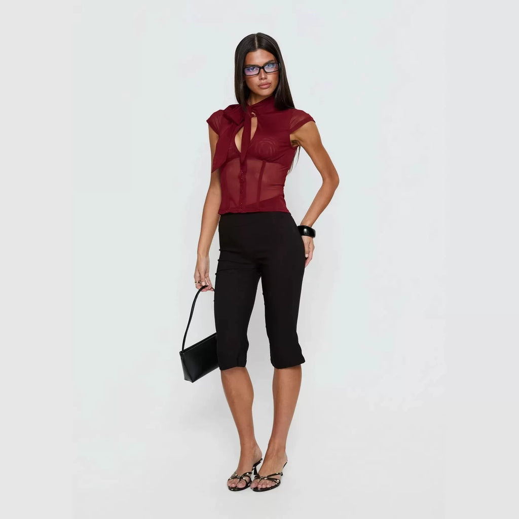 Princess Polly, a high-end and sexy queen, features a combination of wine and red stitching, with a perspective of abstinence. She has a half height stand up collar and short sleeves in wine and red
